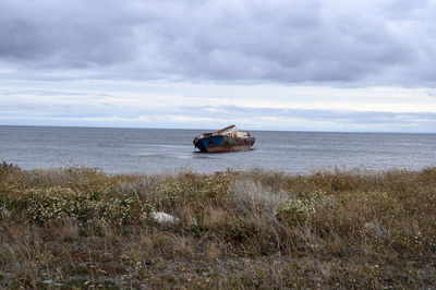 Nautical vessel on sea against sky