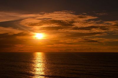 Scenic view of calm sea at sunset