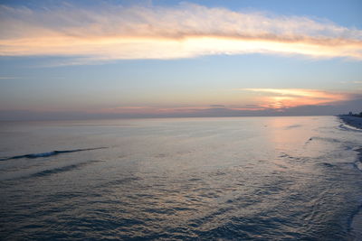 Scenic view of sea against sky at sunset