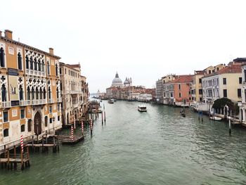 View of canal passing through city buildings