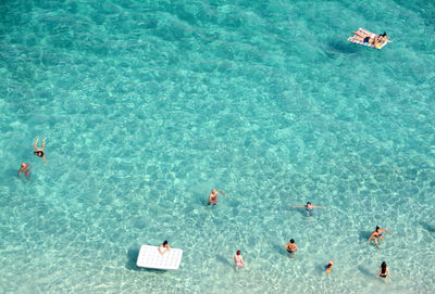 High angle view of people swimming in pool