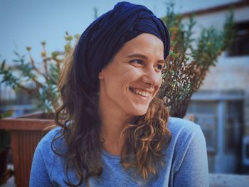 Close-up of smiling woman in city