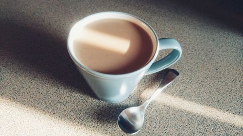 High angle view of coffee cup on table