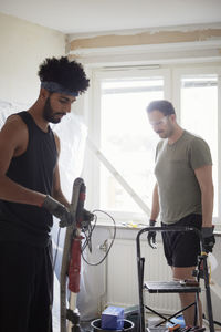 Men working in apartment during renovation
