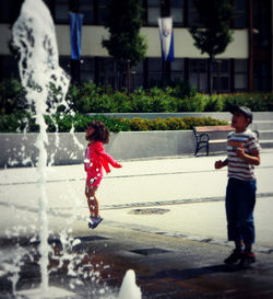 Full length of girl standing in water