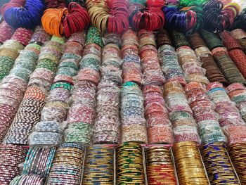 Full frame shot of multi colored bangles for sale in market