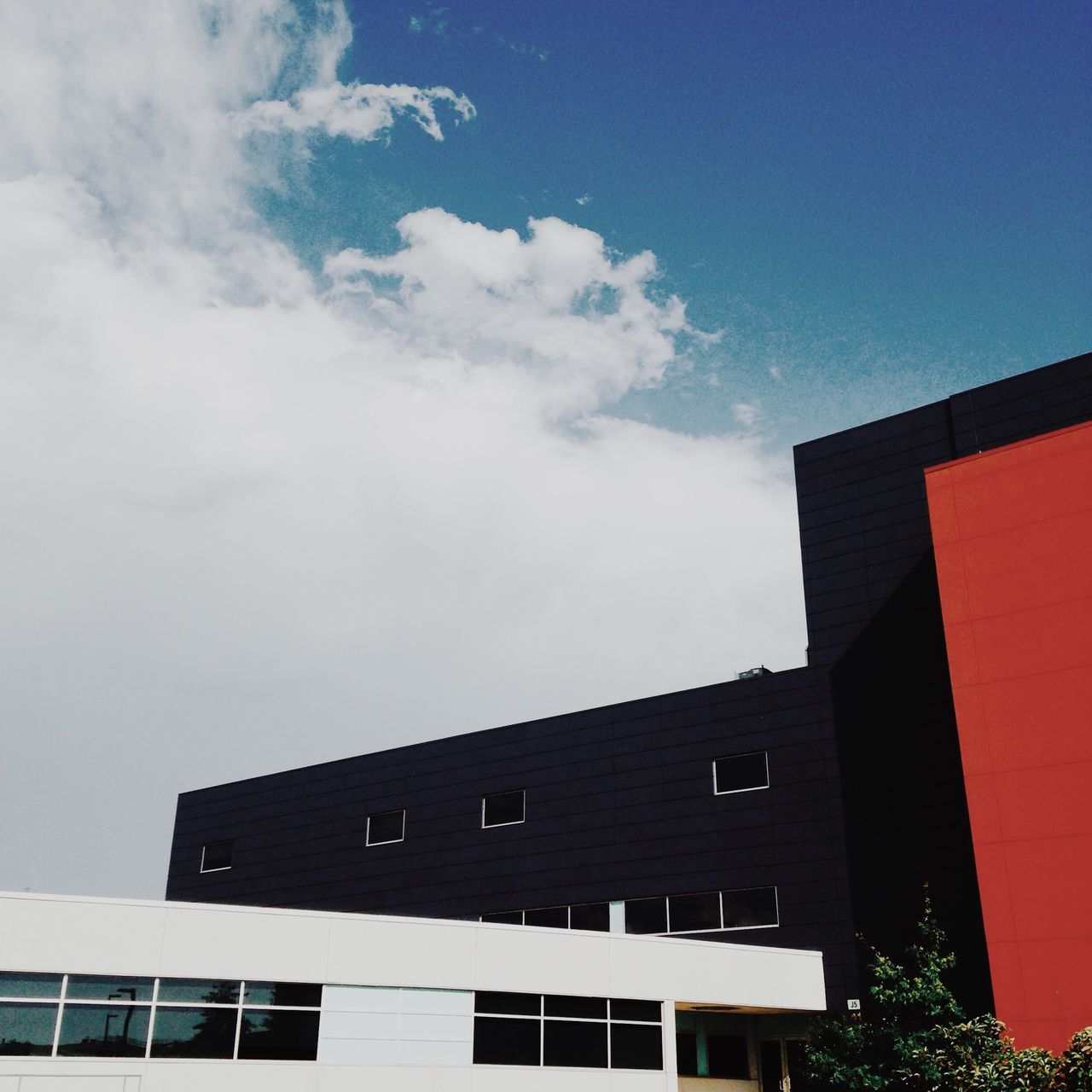 building exterior, architecture, built structure, low angle view, sky, residential structure, residential building, window, building, house, cloud - sky, city, high section, outdoors, day, no people, cloud, exterior, blue, cloudy