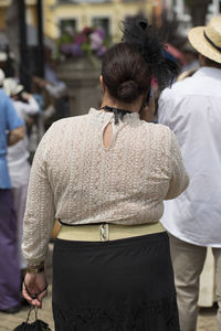 Rear view of woman standing outdoors