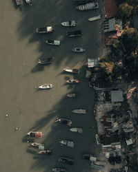 High angle view of cars on street amidst buildings in city