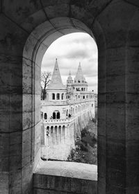 View of old building against cloudy sky