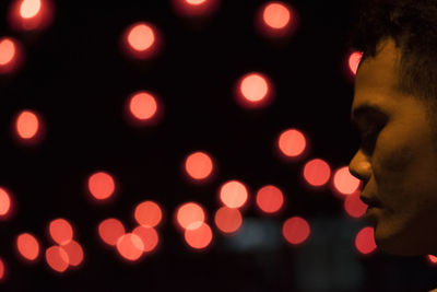 Close-up of illuminated lights at night