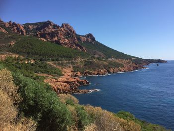 Scenic view of sea against clear blue sky