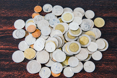 High angle view of coins on table