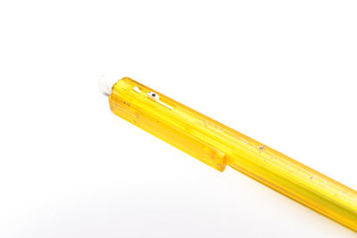 Close-up of yellow pencils against white background