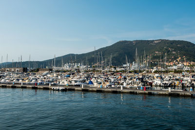 Boats moored at harbor