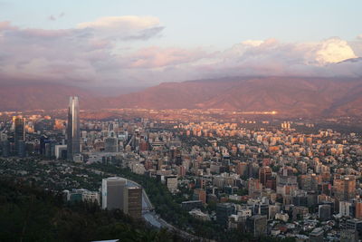 Aerial view of city at sunset