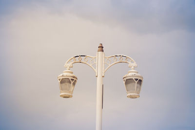 Low angle view of street light against sky