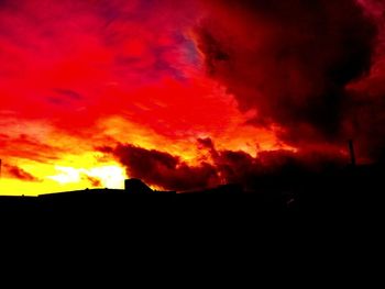 Low angle view of dramatic sky during sunset