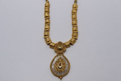 Close-up of cross against white background