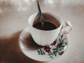 High angle view of coffee cup on table