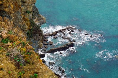 High angle view of rocks in sea