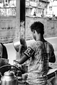 Midsection of man holding ice cream