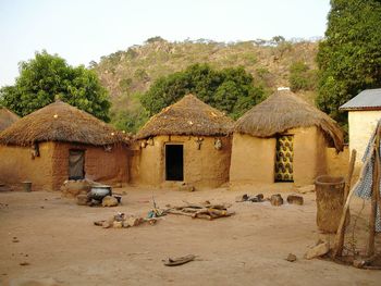 Huts in village by mountains