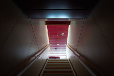 Steps in illuminated corridor