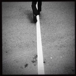 Low section of woman standing on ground