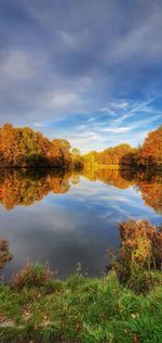 Scenic view of lake against sky during autumn