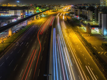 High angle view of light trails on road at night