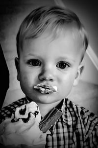 Close-up portrait of boy eating ice cream