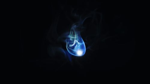 Close-up of smoke over black background