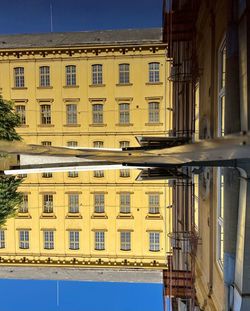 Low angle view of residential building against blue sky