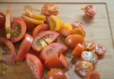 High angle view of sliced tomatoes on cutting board