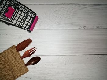 High angle view of hand on white table against wall
