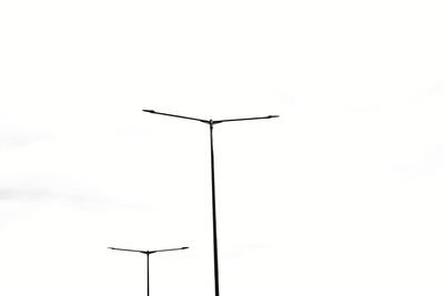 Low angle view of street light against sky