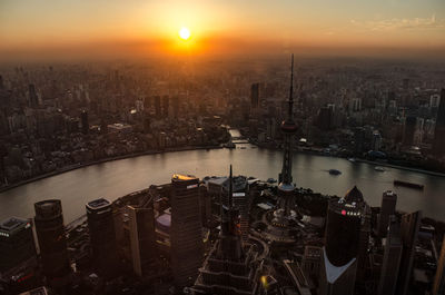 Aerial view of city during sunset