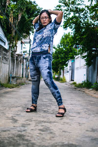 Full length portrait of happy young woman