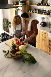 Woman preparing food in kitchen at home