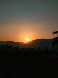 Scenic view of silhouette landscape against sky during sunset