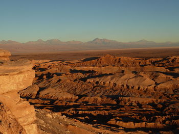 Scenic view of desert against clear sky