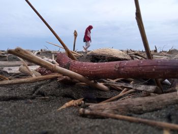 Close-up of damaged boat against sky