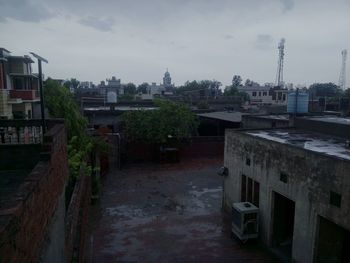 Houses against sky in city