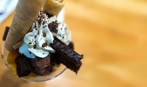 Close-up of ice cream cone on cake