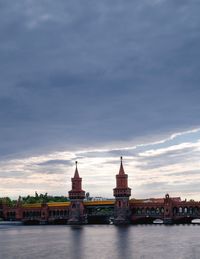 River in city against sky