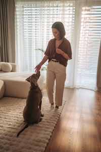 Side view of young man with dog