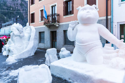 White sculpture on snow covered building