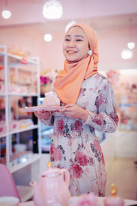 Portrait of a smiling young woman