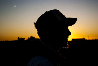 Close-up of silhouette man against sky during sunset